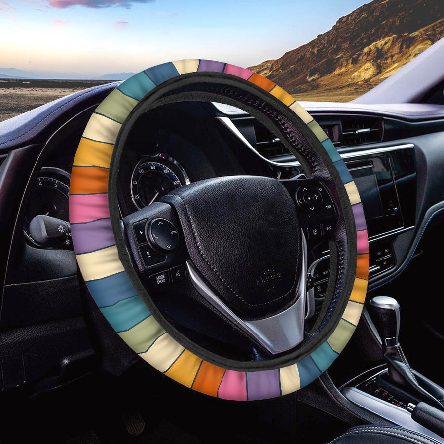 Descending Rainbow Steering Wheel Covers fitted on a car steering wheel