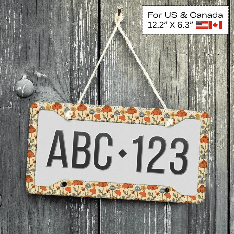 Hippie Mushroom Love License Plate Frame displayed on a wooden wall