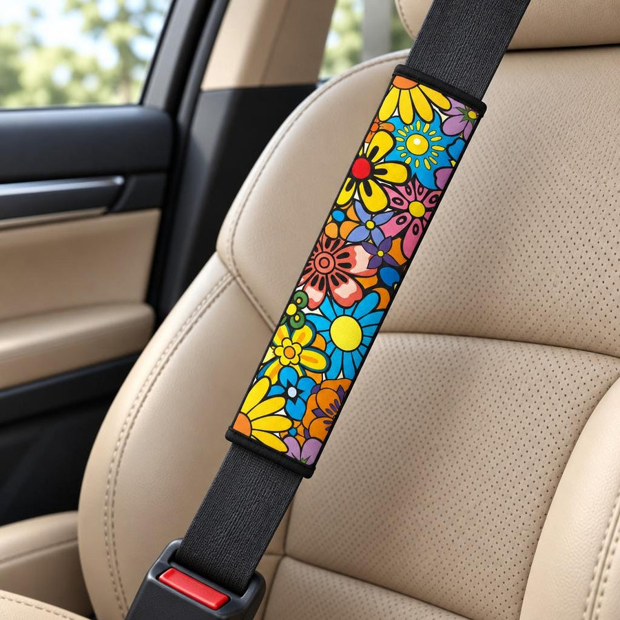 Floral Dream Seat Belt Covers (Set of 2) wrapped around a car seat belt across a tan leather front seat
