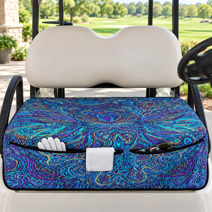 Psychedelic Blue Swirl Golf Cart Seat Cover with front pockets holding a golf towel, gloves and sunglasses, on a golf cart under a clubhouse veranda