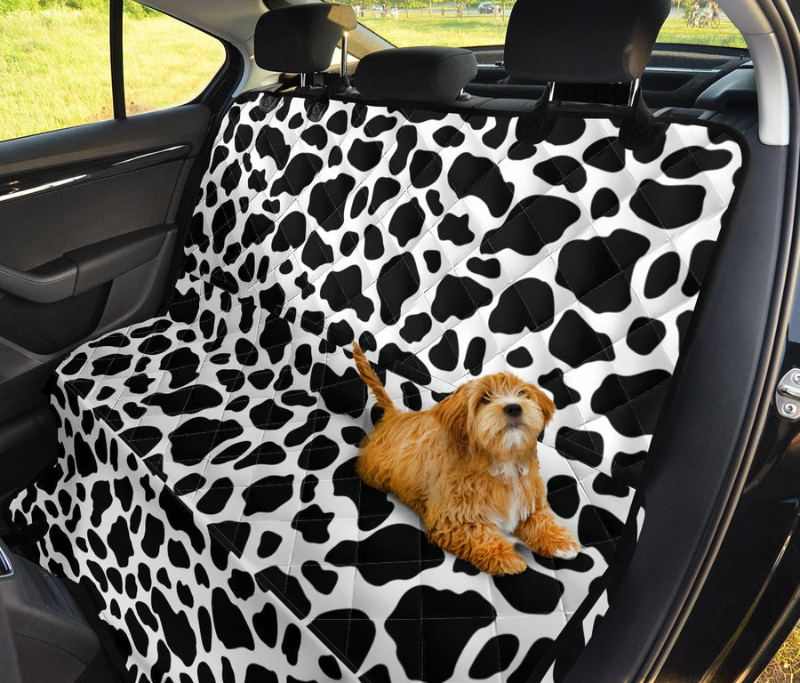 Cow Print Dog Car Seat Covers with a dog sitting on it in a car back seat