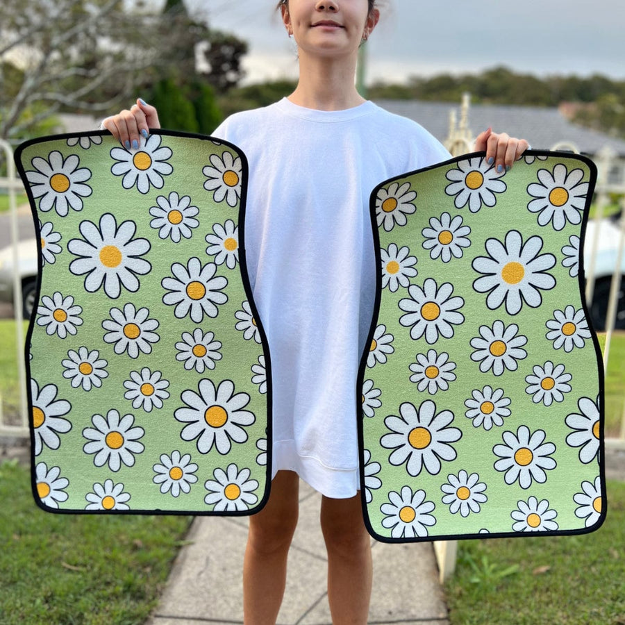 Sage Green Daisy Car Floor Mats held up to show the print