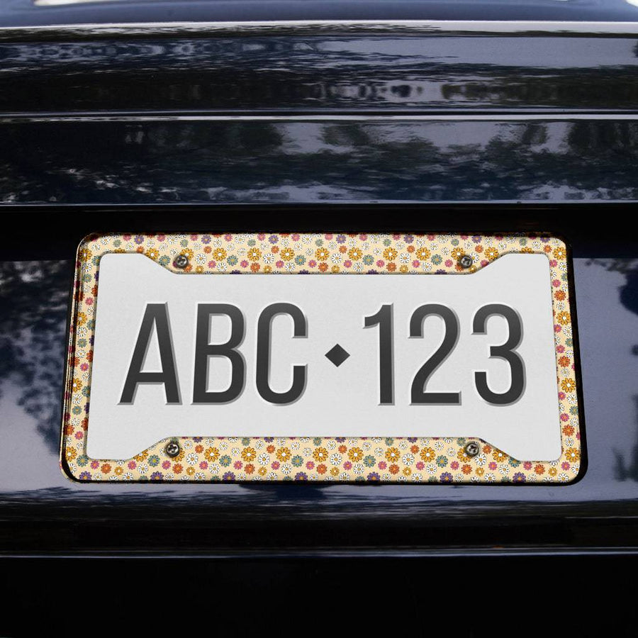 Boho Hippie Daisies License Plate Frame on the back of a car
