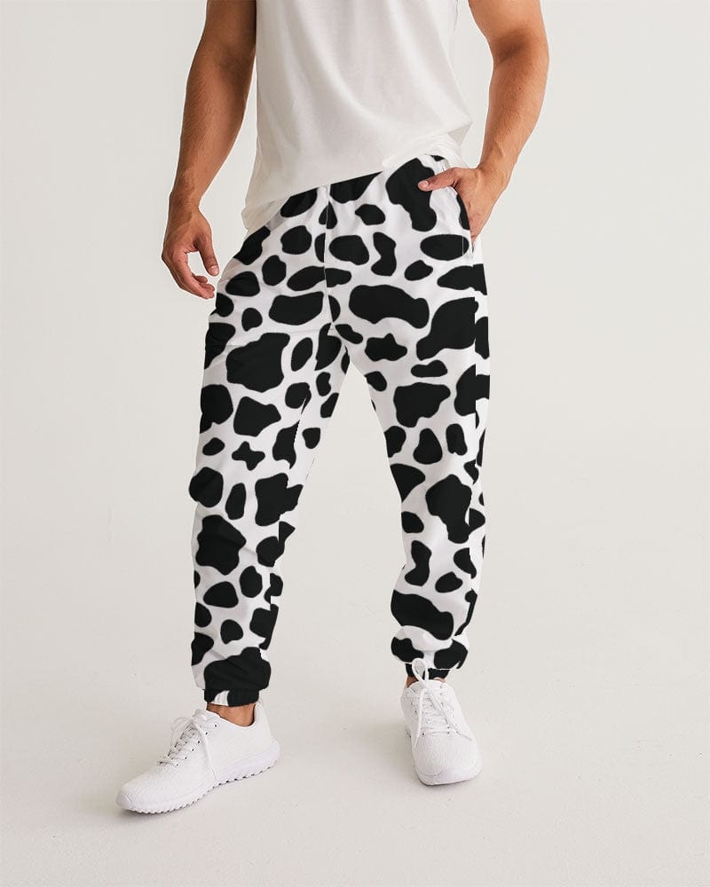 Cow Print Men's Track Pants worn by a model