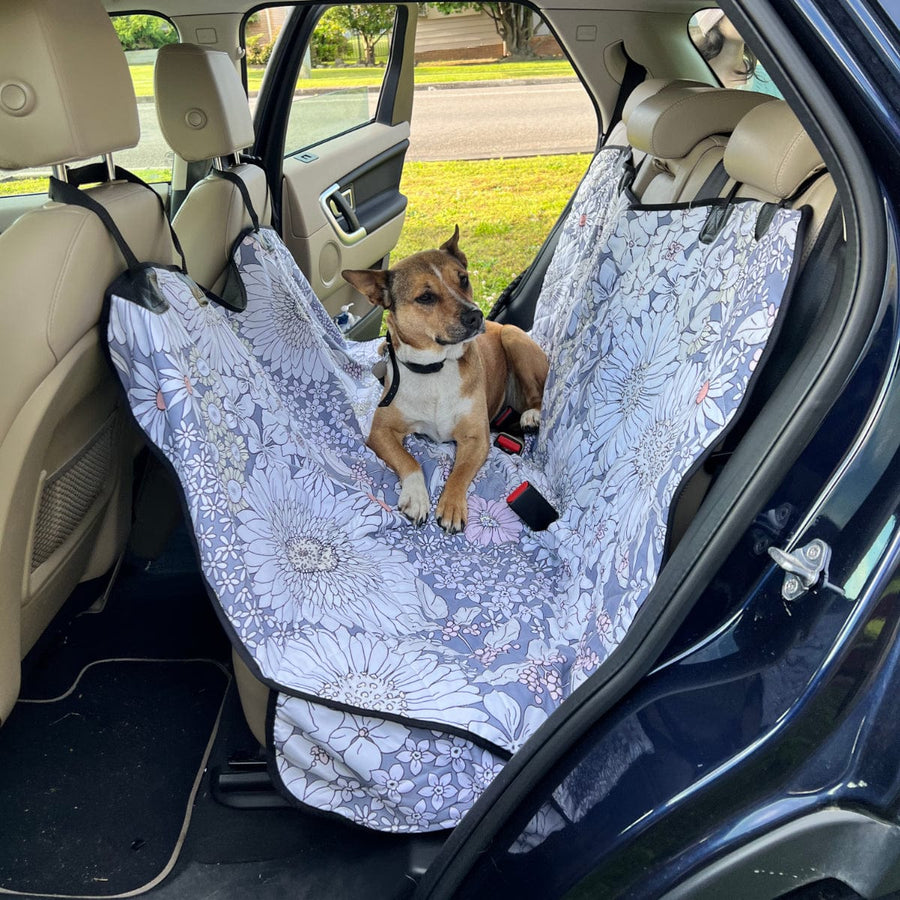 Snowy Field Of Flowers Dog Car Seat Covers fitted across a car back seat